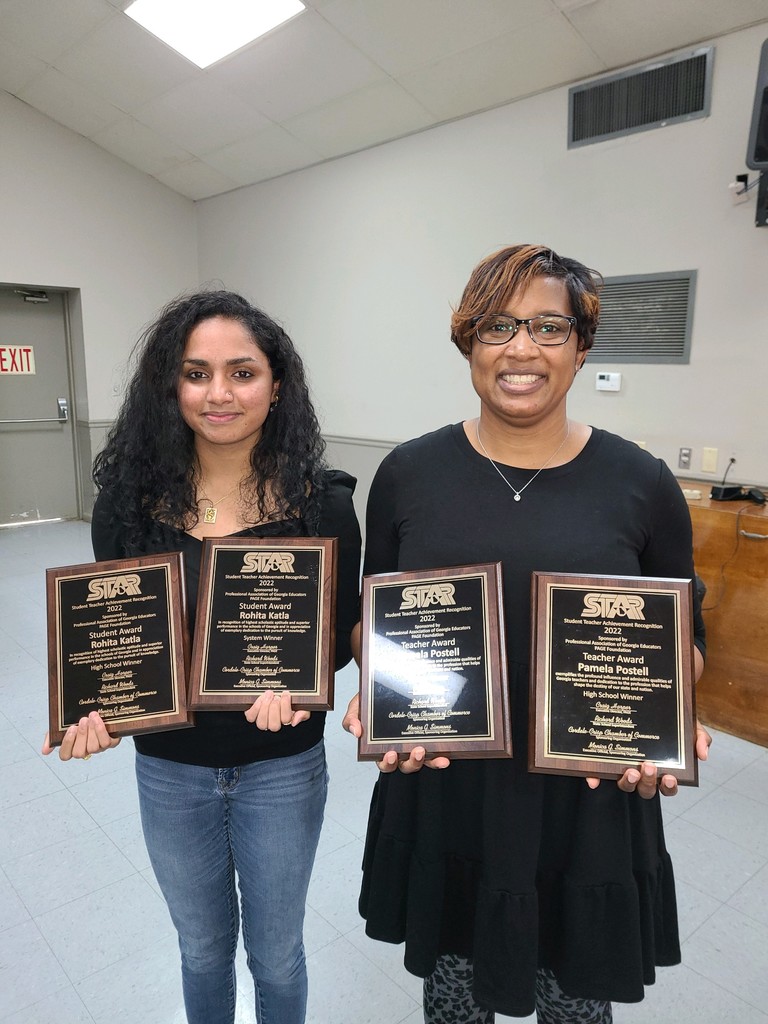 Pam Postell and  Rohita Katla with their awards