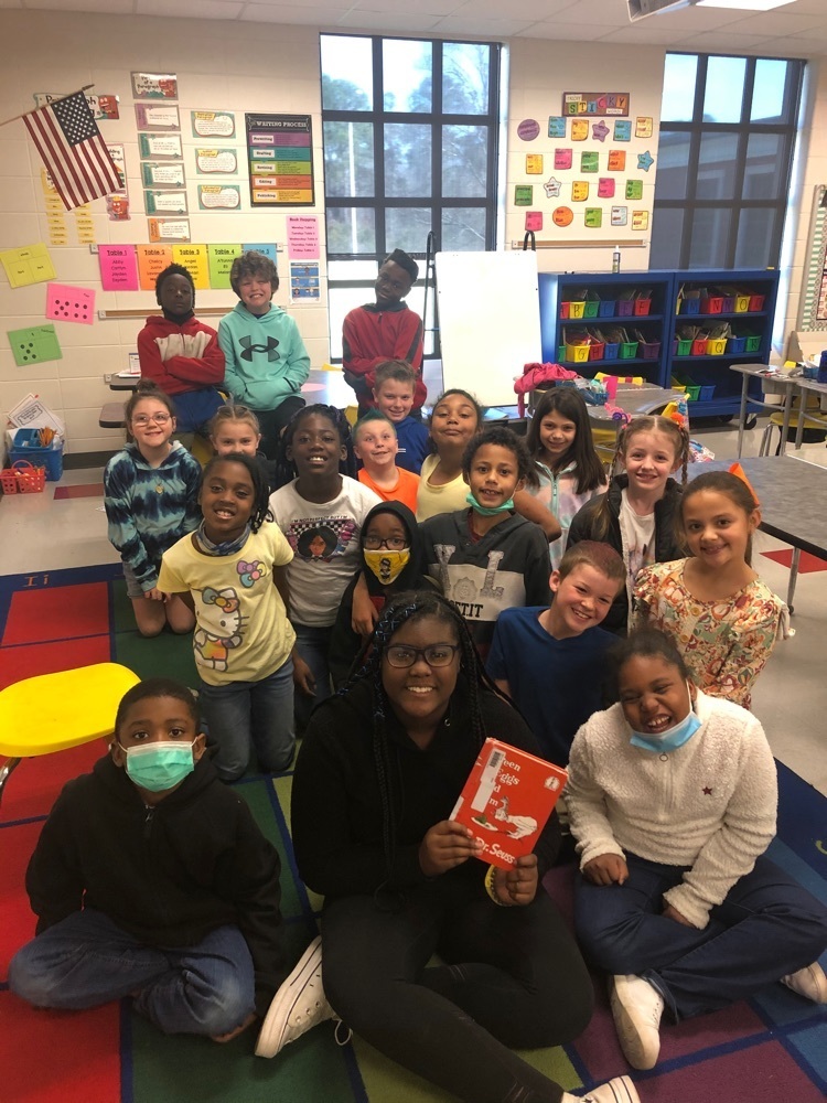 photo of student reading to class