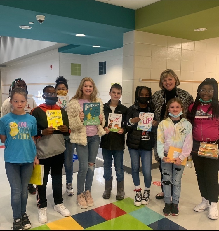 Students pictured with books for read along day