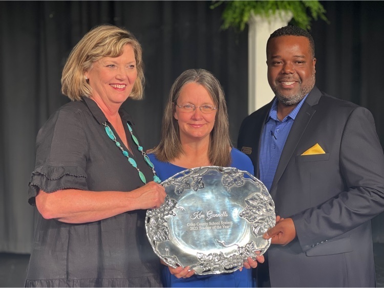 3 people in photo holding plaque 